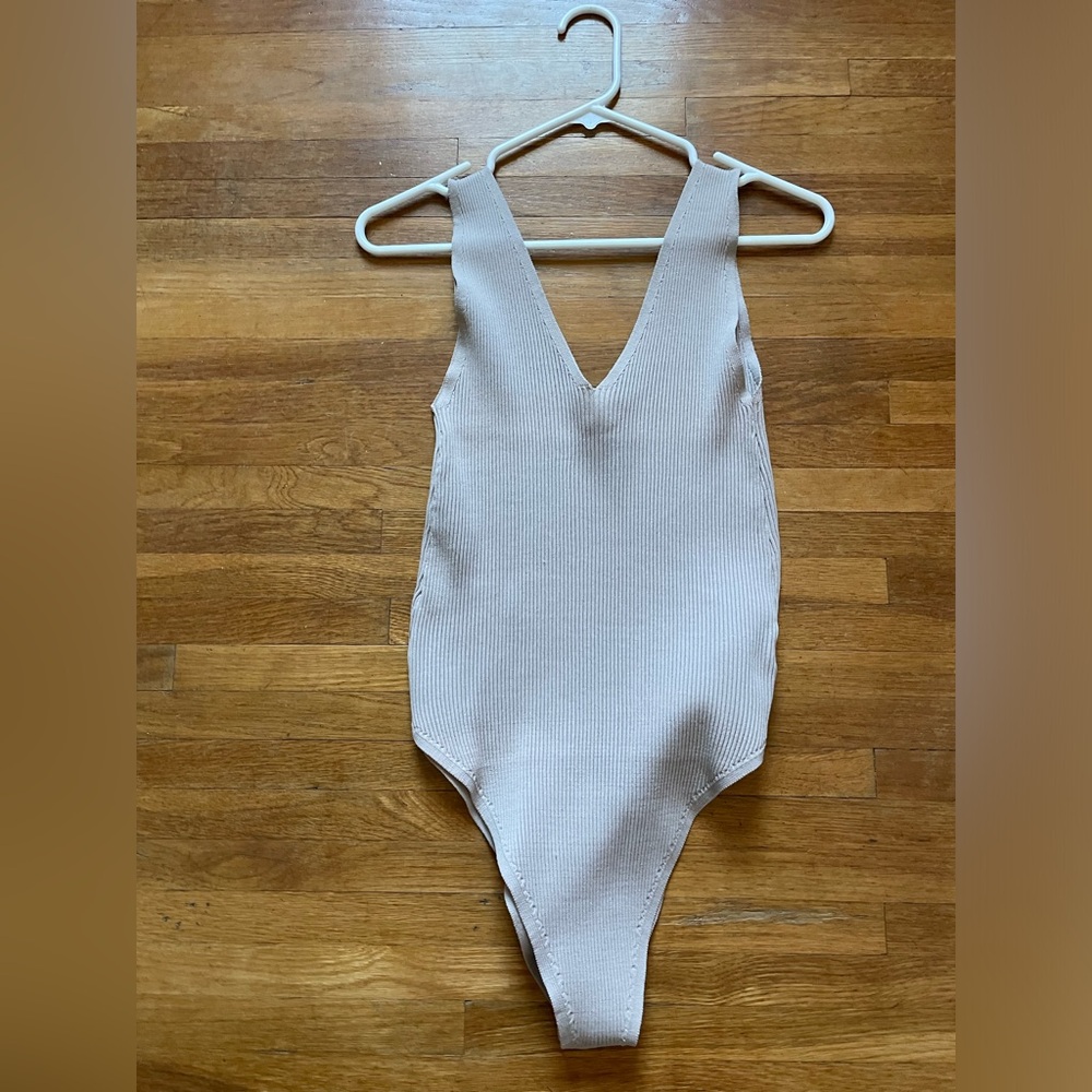 New without tags. Tank top (bodysuit). Color Light Brown. Size Large.